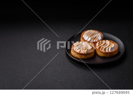 Lemon tart, meringue pie or fruit cream tart Lemon tart, meringue pie or fruit cream tart 127689095