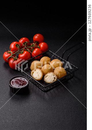 Cheese fried balls or croquettes with potatoes or rice Cheese fried balls or croquettes with potatoes or rice 127689236