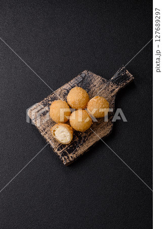 Cheese fried balls or croquettes with potatoes or rice Cheese fried balls or croquettes with potatoes or rice 127689297