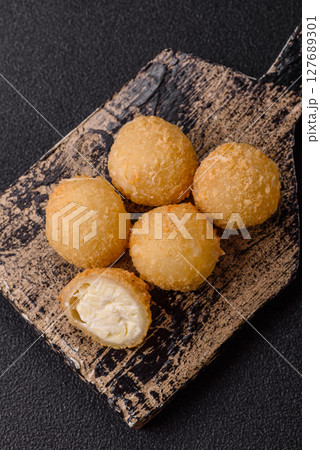 Cheese fried balls or croquettes with potatoes or rice Cheese fried balls or croquettes with potatoes or rice 127689301