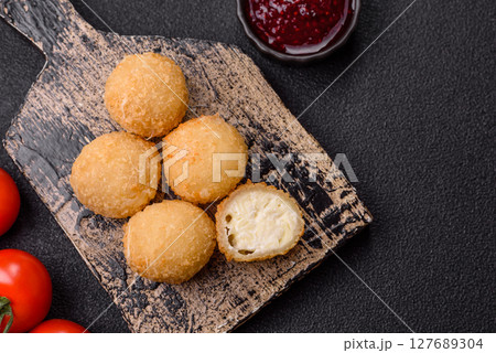 Cheese fried balls or croquettes with potatoes or rice Cheese fried balls or croquettes with potatoes or rice 127689304