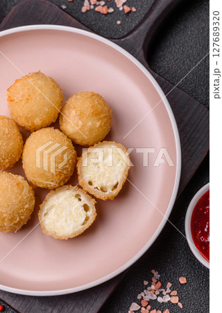 Cheese fried balls or croquettes with potatoes or rice Cheese fried balls or croquettes with potatoes or rice 127689320