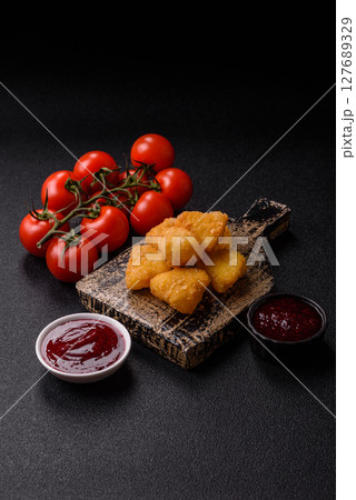 Fried mozzarella or brie cheese with cranberry or raspberry sauce Fried mozzarella or brie cheese with cranberry or raspberry sauce 127689329