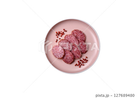 Sliced salami sausage, smoked meat, delicious deli snacks 127689480