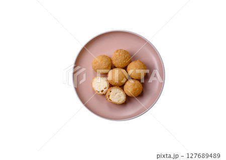Cheese fried balls or croquettes with potatoes or rice 127689489