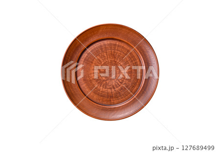 Empty ceramic plate on a monochrome brown background 127689499