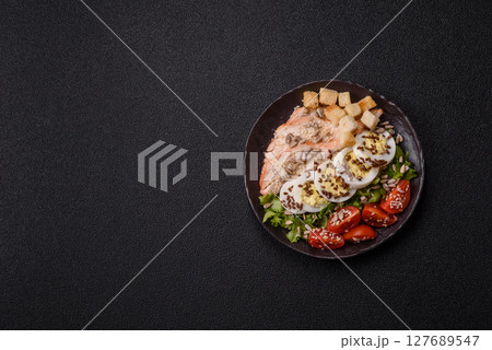 Bowl with caesar salad with chicken, parmesan cheese, tomatoes, croutons, lettuce leaves Bowl with caesar salad with chicken, parmesan cheese, tomatoes, croutons, lettuce leaves 127689547