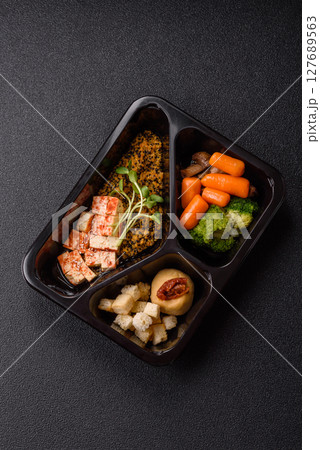 Food bowl with tofu, quinoa, broccoli and carrots, microgreens Food bowl with tofu, quinoa, broccoli and carrots, microgreens 127689563