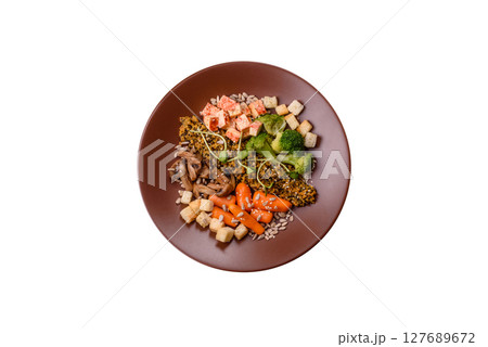 Food bowl with tofu, quinoa, broccoli and carrots, microgreens 127689672