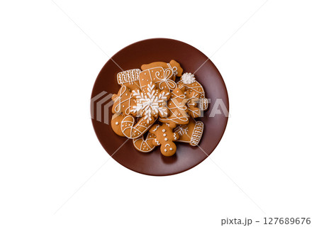 Christmas winter gingerbread, holiday biscuits on monochrome background Christmas winter gingerbread, holiday biscuits on monochrome background 127689676