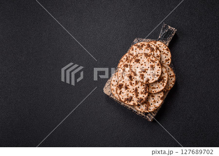 Matzah wheat bread for the Jewish holiday of passover. Kosher matzo bread Matzah wheat bread for the Jewish holiday of passover. Kosher matzo bread 127689702