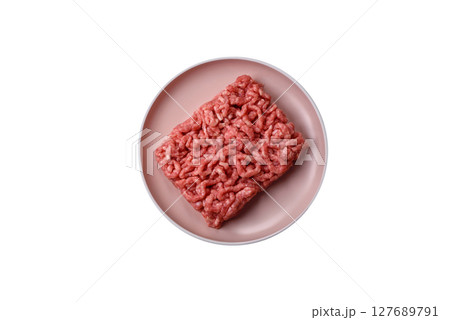 Stuffing or ground raw beef or pork with salt and spices 127689791