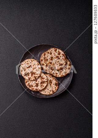 Matzah wheat bread for the Jewish holiday of passover. Kosher matzo bread Matzah wheat bread for the Jewish holiday of passover. Kosher matzo bread 127689833