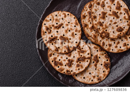 Matzah wheat bread for the Jewish holiday of passover. Kosher matzo bread Matzah wheat bread for the Jewish holiday of passover. Kosher matzo bread 127689836