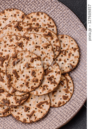 Matzah wheat bread for the Jewish holiday of passover. Kosher matzo bread Matzah wheat bread for the Jewish holiday of passover. Kosher matzo bread 127689857