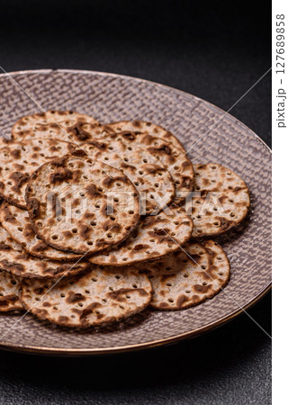 Matzah wheat bread for the Jewish holiday of passover. Kosher matzo bread Matzah wheat bread for the Jewish holiday of passover. Kosher matzo bread 127689858