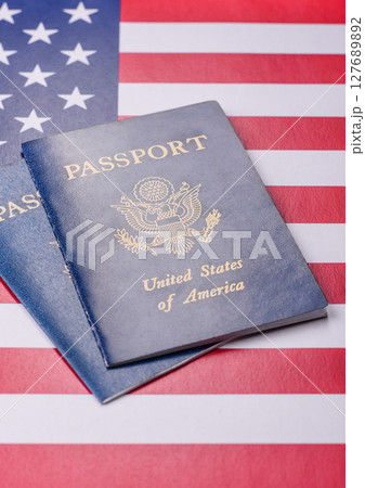 American passport against the background of the US national flag 127689892
