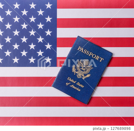 American passport against the background of the US national flag 127689898