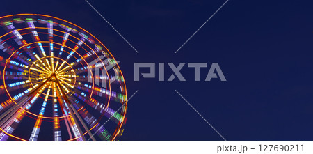 Colorful Ferris Wheel Lights at Night banner background Colorful Ferris Wheel Lights at Night banner background 127690211