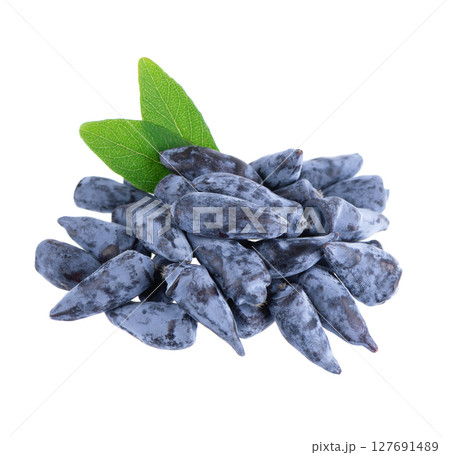 Honeysuckle berry isolated on white background. Fresh honeysuckle blue berry fruits with green leaves. Clipping path. 127691489