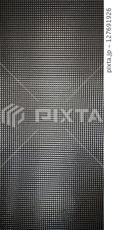 Cut Glass Texture With Intricate Patterns Reflecting Light in Bright Surroundings 127691926