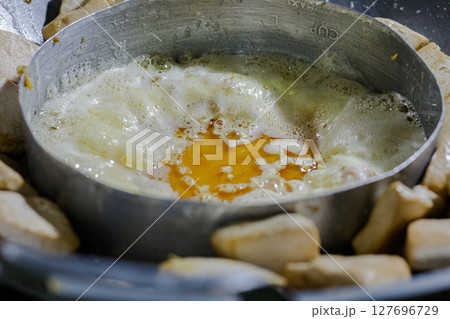 Cooking Process of Frying Tofu Pieces and Egg in a Traditional Wok Cooking Process of Frying Tofu Pieces and Egg in a Traditional Wok 127696729