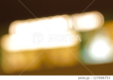 Beautiful bokeh effect with diffused light circles in dark space. 127696753