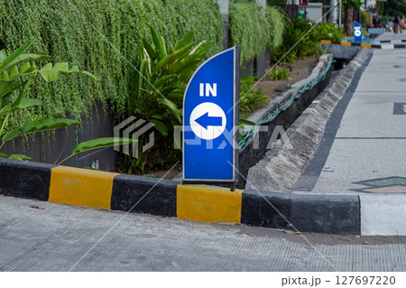 Blue IN Direction Sign With Left Arrow Blue IN Direction Sign With Left Arrow 127697220