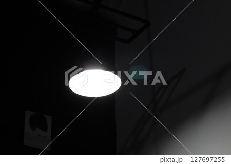 Modern Ceiling Light Fixture in Industrial Interior 127697255