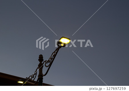 Modern LED Street Light Illuminating Twilight Sky Modern LED Street Light Illuminating Twilight Sky 127697259