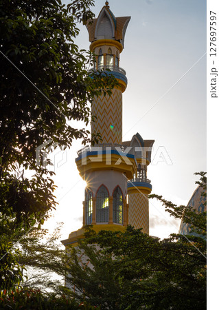 Islamic Architecture: Ornate Minaret with Gold Accents Islamic Architecture: Ornate Minaret with Gold Accents 127697597