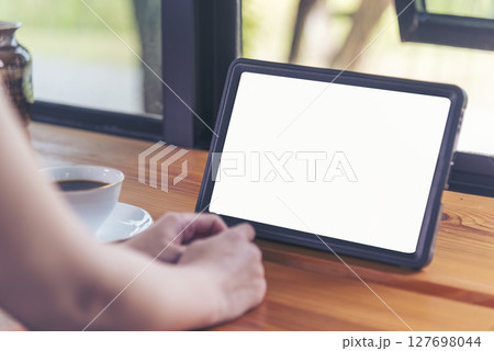 Woman hands using smartphone digital technology tablet empty blank screen. Close up Hands women holding smart tablet touch screen shopping online, call. Woman using mock up mobile at home office Woman hands using smartphone digital technology tablet empty blank screen. Close up Hands women holding smart tablet touch screen shopping online, call. Woman using mock up mobile at home office 127698044