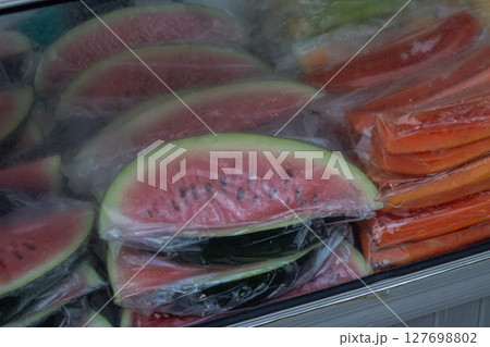 Sliced Watermelon and Papaya in Plastic Packs Sliced Watermelon and Papaya in Plastic Packs 127698802