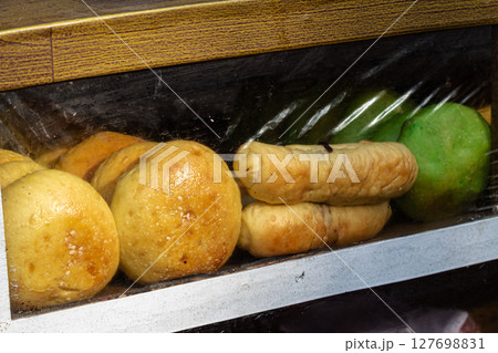 Assorted Local Breads and Pastries in Display Case Assorted Local Breads and Pastries in Display Case 127698831