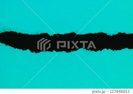 Light blue ripped paper placed on black background paper with copy space 127698853