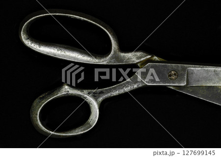 Top view of old metal scissors handle isolated on black background Top view of old metal scissors handle isolated on black background 127699145