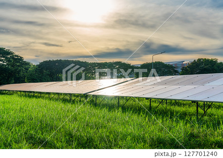 Photovoltaic modules solar power plant on dramatic sunset sky background,clean Alternative power energy concept. Photovoltaic modules solar power plant on dramatic sunset sky background,clean Alternative power energy concept. 127701240