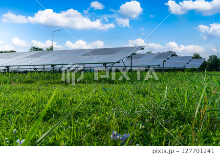 Photovoltaic solar power panel on dramatic sunset blue sky background, green clean Alternative power energy concept. Photovoltaic solar power panel on dramatic sunset blue sky background, green clean Alternative power energy concept. 127701241