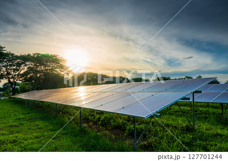 Photovoltaic modules solar power plant on dramatic sunset sky background,clean Alternative power energy concept. Photovoltaic modules solar power plant on dramatic sunset sky background,clean Alternative power energy concept. 127701244