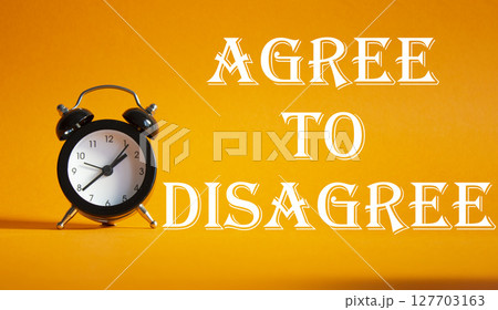 Agree to Disagree symbol. Beautiful orange background with alarm clock. Business and Agree to Disagree concept. Copy space. 127703163
