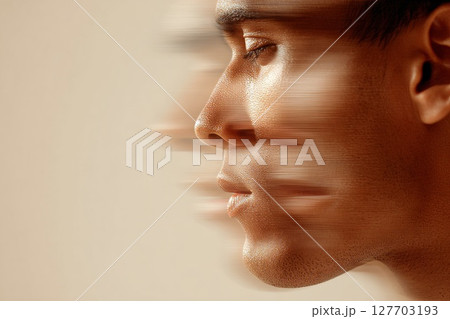 Profile of a young man with motion blur effect conveying speed and dynamic energy in a soft background 127703193
