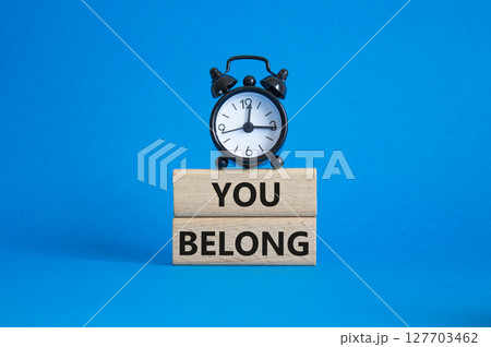 You belong symbol. Concept words You belong on wooden blocks. Beautiful blue background with alarm clock. Business and You belong concept. Copy space. You belong symbol. Concept words You belong on wooden blocks. Beautiful blue background with alarm clock. Business and You belong concept. Copy space. 127703462