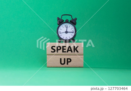 Speak Up symbol. Wooden blocks with words Speak Up Beautiful green background with alarm clock. Business and Speak Up concept. Copy space. Speak Up symbol. Wooden blocks with words Speak Up Beautiful green background with alarm clock. Business and Speak Up concept. Copy space. 127703464