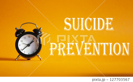 Suicide Prevention symbol. Concept words Suicide Prevention on Beautiful orange background with alarm clock. Medicine and Suicide Prevention concept. Copy space. 127703567