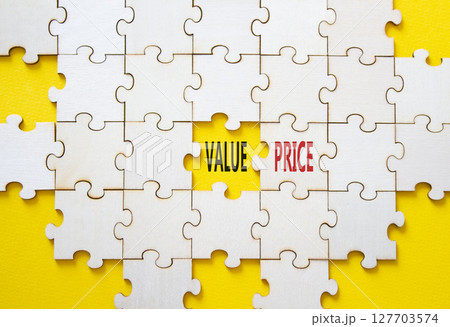 Price and Value symbol. Concept word Price and Value on wooden puzzle. Beautiful yellow background. Business and Price and Value concept. Copy space Price and Value symbol. Concept word Price and Value on wooden puzzle. Beautiful yellow background. Business and Price and Value concept. Copy space 127703574