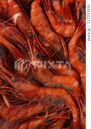 Frozen red shrimp close-up with ice crystals 127703930