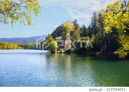 Orthodox Chapel of the Holy Prophet Solomon on the shore of a Emerald Lake among the mountains and forests Orthodox Chapel of the Holy Prophet Solomon on the shore of a Emerald Lake among the mountains and forests 127704051