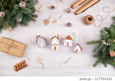 Merry Christmas greeting card. Toy wooden houses Merry Christmas greeting card. Toy wooden houses 127704103