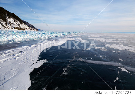 Frozen Lake Baikal. Fields of ice hummocks near the shore Frozen Lake Baikal. Fields of ice hummocks near the shore 127704722