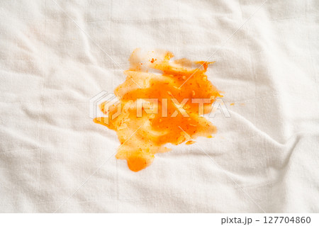 Dirty tomato sauce stain or ketchup on cloth to wash with washing powder, cleaning housework. Dirty tomato sauce stain or ketchup on cloth to wash with washing powder, cleaning housework. 127704860